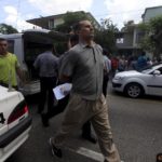 Cuban dissident Jose Daniel Ferrer, is detained by Cuban security personnel after a march protest of The Ladies in White group, in Havana