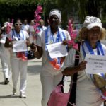 The Ladies in White, an opposition group, hold flowers as they march during their weekly anti-government protest in Havana