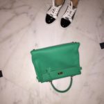 Jean laced up her Louboutin sneakers and took to the streets armed with her beloved  green Hermes Kelly bag.