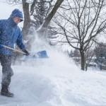 man-shoveling-snow-from-sidewalk-after-storm-16×9-1024×576