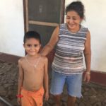 Costa Rican woman with her grandson outside her home in rural Costa Rica.