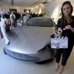 An employee polishes an Aston Martin DB10 engineered by Aston Martin for the James Bond film “Spectre”, during a media preview of “Spectre – the Auction” at Christie’s auction house in London