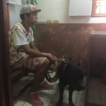 Enriique Angulo Reyes with his dog Galafi waiting to see Dr. Giovanna Bulgarelli Jiminez in Liberia, Costa Rica
