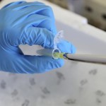 researcher-holds-medical-equipment