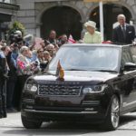 Britain’s Queen Elizabeth is driven past well wishers on her 90th birthday with Prince Philip in Windsor, west of London
