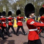 The Queen’s Guards march during Changing of the Guard ceremony outside Buckingham Palace in London