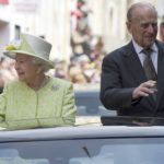 Britain’s Queen Elizabeth and Prince Philip are driven past well-wishers during celebrations for the Queen’s 90th birthday, in Windsor, Britain
