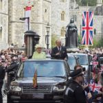 Britain’s Queen Elizabeth and Prince Philip are driven past well-wishers during celebrations for the Queen’s 90th birthday, in Windsor, Britain