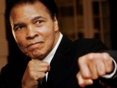 Muhammad Ali poses during the World Economic Forum in Davos, Switzerland January 2006. REUTERS/Andreas Meier