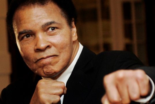 Muhammad Ali poses during the World Economic Forum in Davos, Switzerland January 2006. REUTERS/Andreas Meier