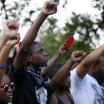 Demonstrators protest the shooting death of Alton Sterling near the headquarters of the Baton Rouge Police Department in Baton Rouge, Louisiana