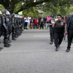 Demonstrators protest the shooting death of Alton Sterling near the headquarters of the Baton Rouge Police Department in Baton Rouge, Louisiana