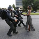 A demonstrator protesting the shooting death of Alton Sterling is detained by law enforcement near the headquarters of the Baton Rouge Police Department in Baton Rouge, Louisiana