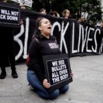 People take part in a protest against police brutality and in support of Black Lives Matter in New York