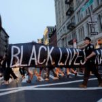 People take part in a protest against police brutality and in support of Black Lives Matter during a march in New York