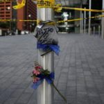 A NYPD tee shirt on makeshift memorial near crime scene two days after a lone gunman ambushed and killed five police officers at a protest decrying police shootings of black men, in Dallas, Texas
