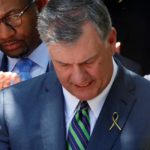 The mayor of Dallas Mike Rawlings takes part in a prayer vigil in a park following the multiple police shooting in Dallas