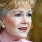 FILE PHOTO: Actress Debbie Reynolds is interviewed at a preview of her Hollywood costume and prop collection in Beverly Hills