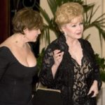 Actress Carrie Fisher and her mother actress Debbie Reynolds arrive for Elizabeth Taylor’s birthday party in Henderson