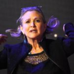 Carrie Fisher poses for cameras as she arrives at the European Premiere of Star Wars, The Force Awakens in Leicester Square, London