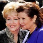 FILE PHOTO: Actress Debbie Reynolds and her daughter Carrie Fisher arrive at the 2011 Primetime Creative Arts Emmy Awards in Los Angeles