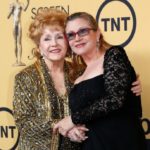 FILE PHOTO: Actress Debbie Reynolds poses with her daughter actress Carrie Fisher backstage after accepting her Lifetime Achievement award at the 21st annual Screen Actors Guild Awards in Los Angeles