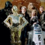 Director and writer of “Star Wars” George Lucas (C) poses with cast members Carrie Fisher and Mark H..