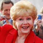 FILE PHOTO: Actress Reynolds is photographed by fans as she arrives at the world premiere of the 40th anniversary restoration of the film “Cabaret” during the opening night gala of the 2012 TCM Classic Film Festival in Hollywood