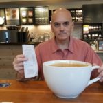 Bill Lewis with the receipt and cup of “most expensive Starbucks coffee” ©SouthFloridaReporter.com