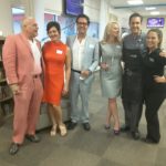Chef Brian Roland and Nicole Roland pose with guests