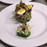 Cucumber canape and grilled octopus cranberry bean tower
