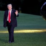President Donald Trump waves as walks on the South Lawn