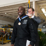 Captain Barrington Irving is inducted into the Broward College Alumni Hall of Fame by David Maymon, member of the Broward College District Board of Trustees.