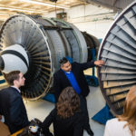 Gilberto Alvarado, Broward College aviation recruiter, gives a tour of the aviation facility.