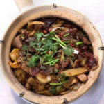 Steamed-rice-in-a-clay-pot-with-chicken-shrimp-pork-mushroom-bamboo-and-Chinese-sausage