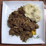 Bigos with mashed potatoes