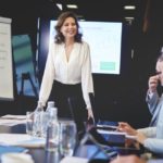 Business woman in conference room giving speech