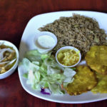 Lambi with plantain mushroom rice and salad