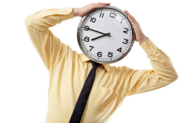 storyblocks/Portrait of a businessman with clock instead of head