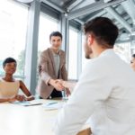 storyblocks/graphicstock-smiling-young-people-shaking-hands-on-business-meeting-in-office_HulPnNXBhl
