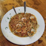 Clams with linguini and red sauce
