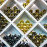 freepik/Wines White Wooden Shelve in Wines Cellar. Wines Selection.