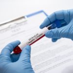 freepik/close-up-hands-holding-virus-samples_23-2148454244