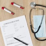 freepik/top-view-coronavirus-test-paper-with-stethoscope-pills_23-2148445142