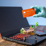 freepik/hand-sterile-glove-holds-shopping-cart-with-credit-card-internet-purchasing-during-coronavirus-pandemic_97716-330