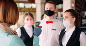 https://www.freepik.com/premium-photo/manager-restaurant-hotel-checks-body-temperature-staff-with-thermal-imaging-device_7975717.htm