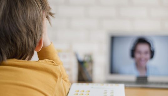 https://www.freepik.com/free-photo/back-view-child-being-tutored-home-through-online-class_7871373.htm