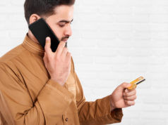https://www.freepik.com/premium-photo/businessman-keeps-credit-card-talks-mobile-phone_6927216.htm
