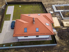 https://www.freepik.com/premium-photo/house-metal-shingle-roof-with-attic-windows-black-car_8141505.htm