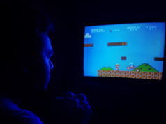 https://www.pexels.com/photo/photo-of-man-playing-super-mario-bros-2728255/
